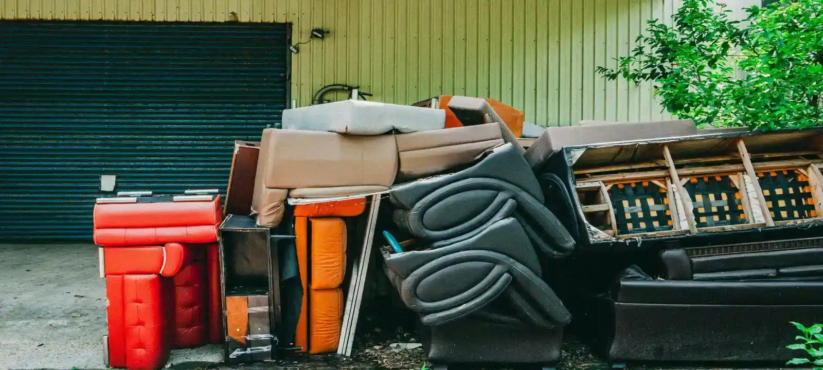 Large household items and bulky waste stacked together requiring a skip bin for cheapest skip bins townsville service solution